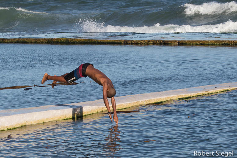 boy diving into pool